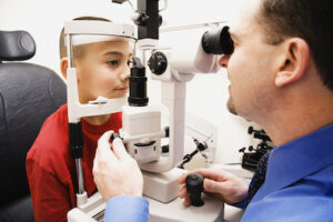 Doctor examining child's eyes