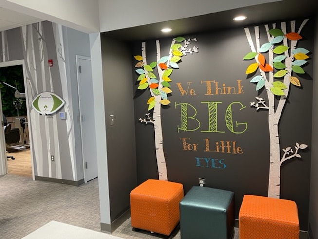 Practice wall with the text "we think big for little eyes"